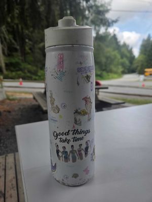 White Sticker-Covered Water Bottle