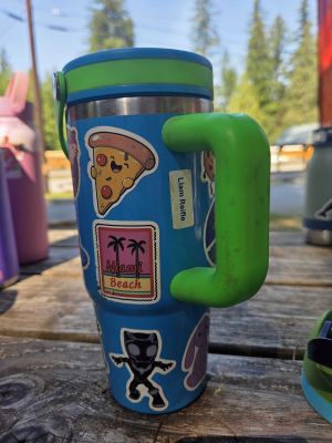 Blue Tumbler with Stickers